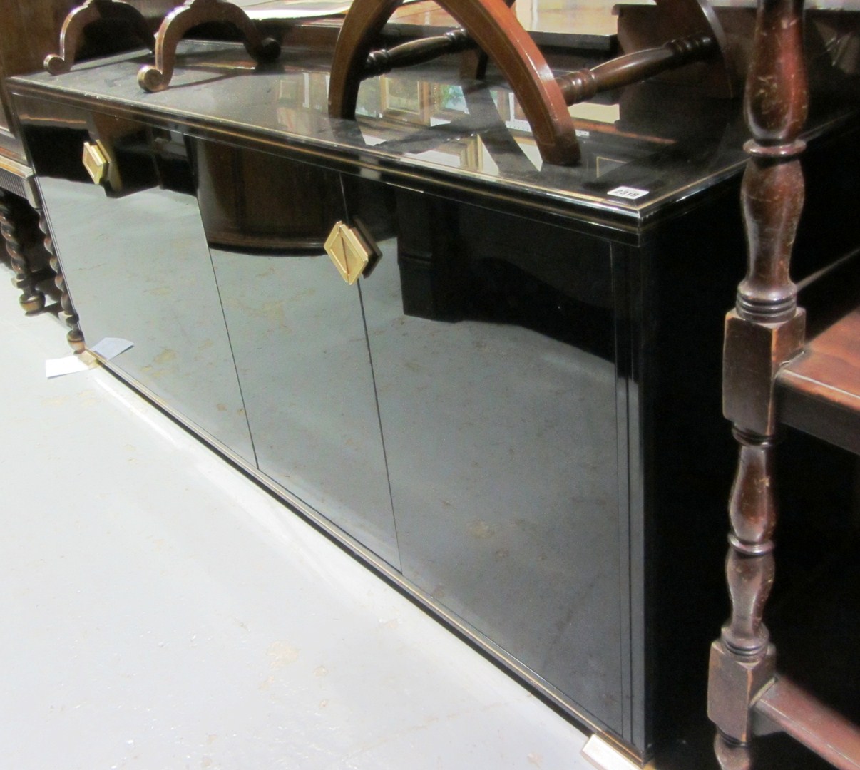 Appraisal: A th century black lacquer four door sideboard