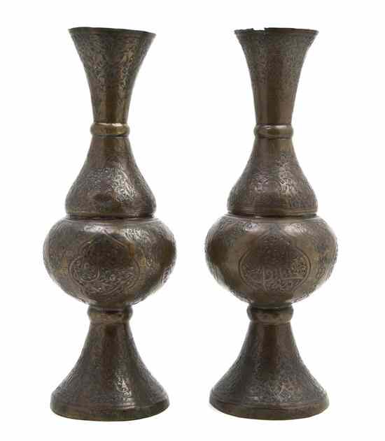 Appraisal: A Pair of Persian Bronze Vases with organic motifs and