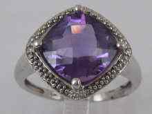 Appraisal: A white metal tests ct gold amethyst and diamond ring