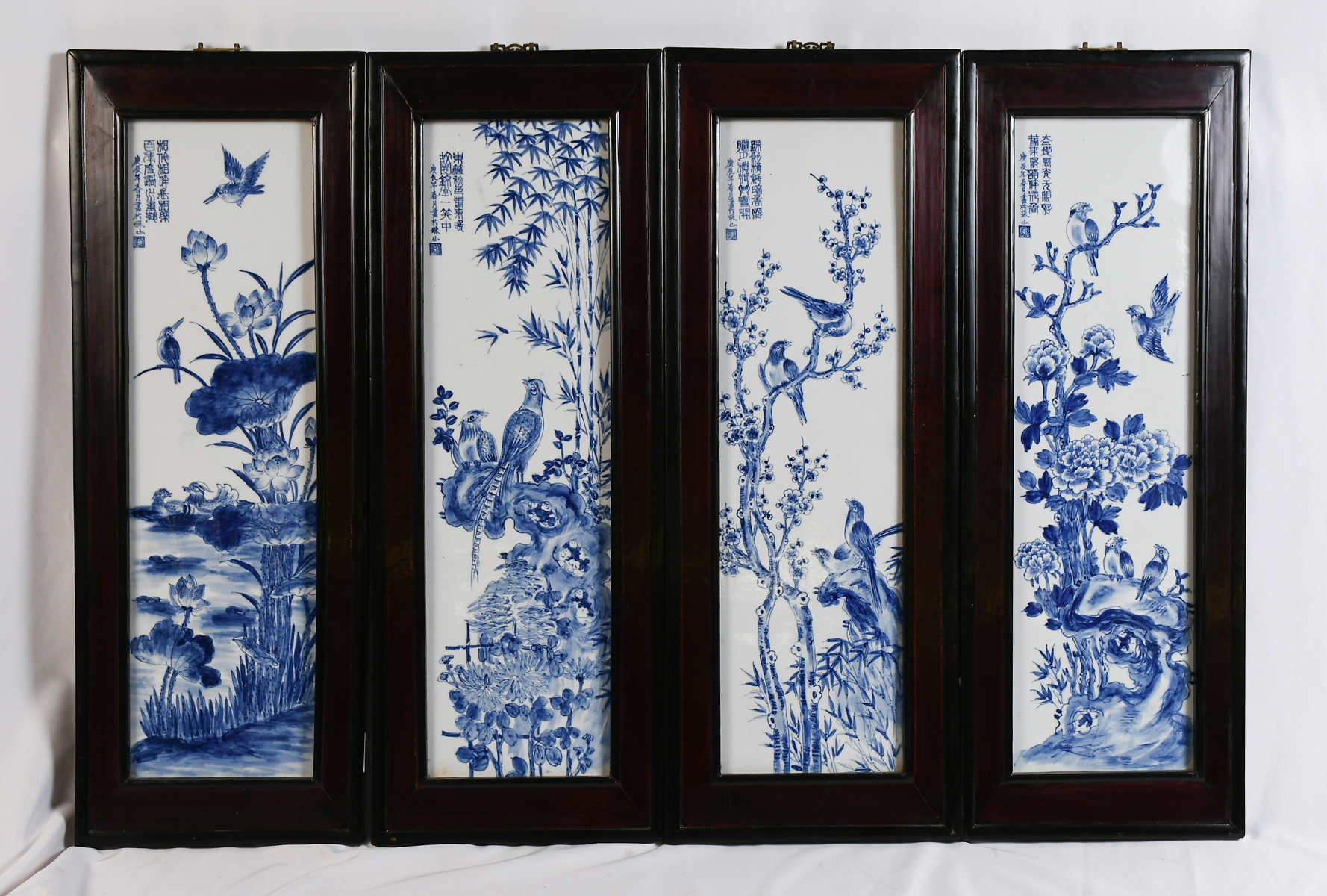 Appraisal: FRAMED CHINESE BLUE WHITE PORCELAIN PANELS Chinese porcelain panels having