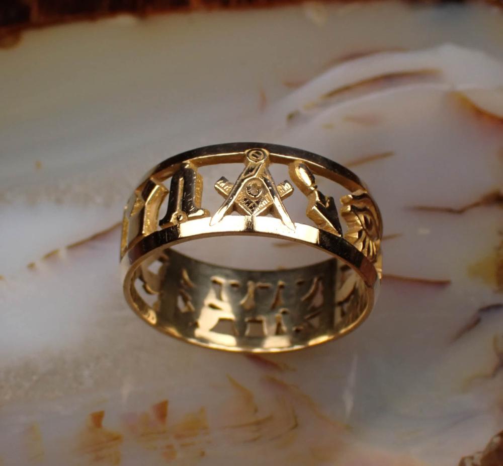 Appraisal: MAN'S FOURTEEN KARAT YELLOW GOLD MASONIC BAND pierced and engraved