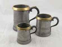 Appraisal: Three Victorian pewter official measures with brass rims and Victorian