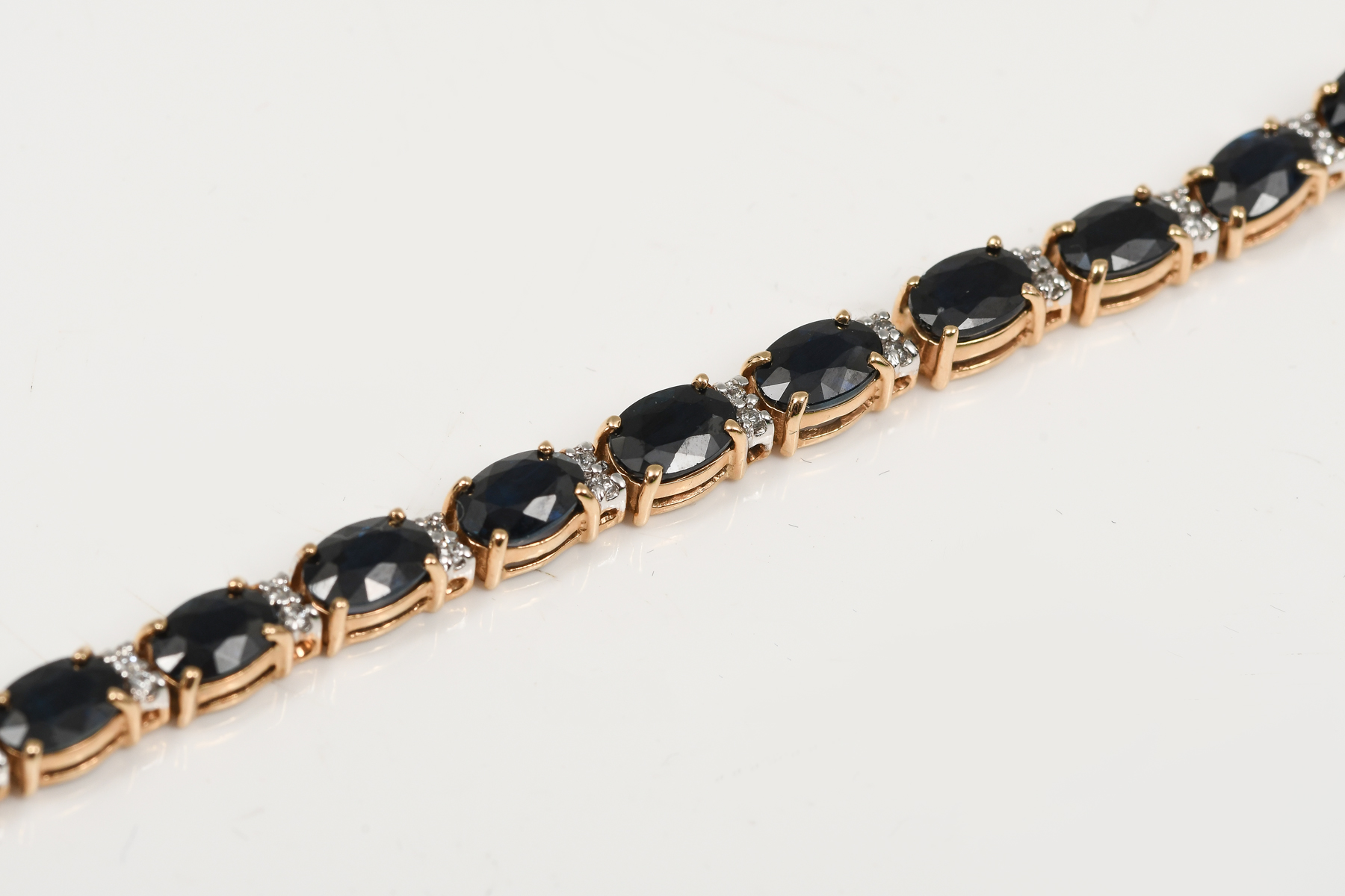 Appraisal: K SAPPHIRE DIAMOND BRACELET K yellow gold bracelet contains oval