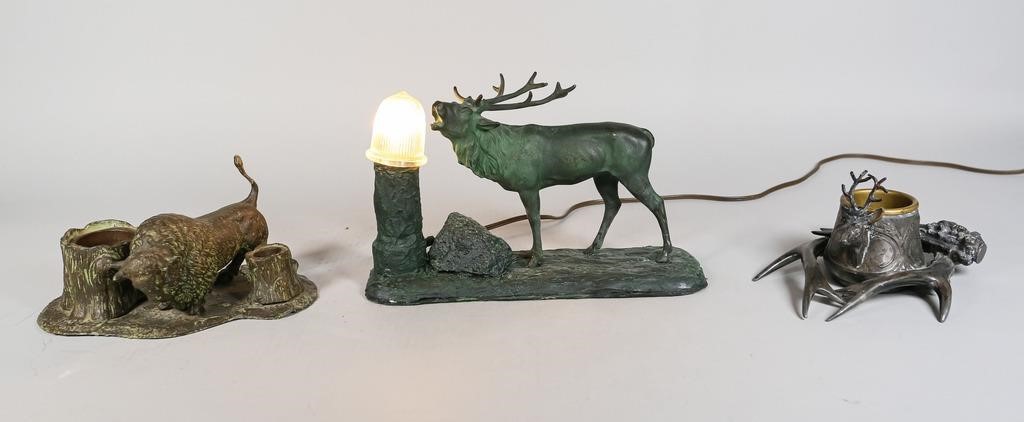 Appraisal: Painted composite table lamp with bronze moose Painted metal buffalo