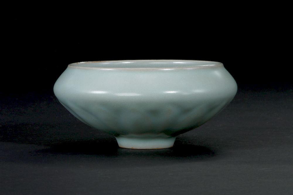 Appraisal: Chinese Longquan Celadon Lotus Bowl The flaring rounded sides rising