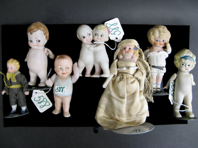 Appraisal: SEVEN MINIATURE BISQUE DOLLS painted features and molded hair most