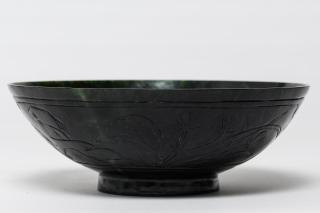 Appraisal: Spinach Jade Footed Bowl The exterior with incised panels of