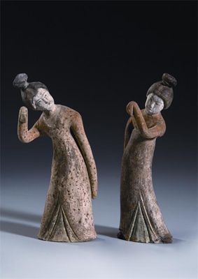 Appraisal: A pair of Chinese unglazed and painted pottery models of