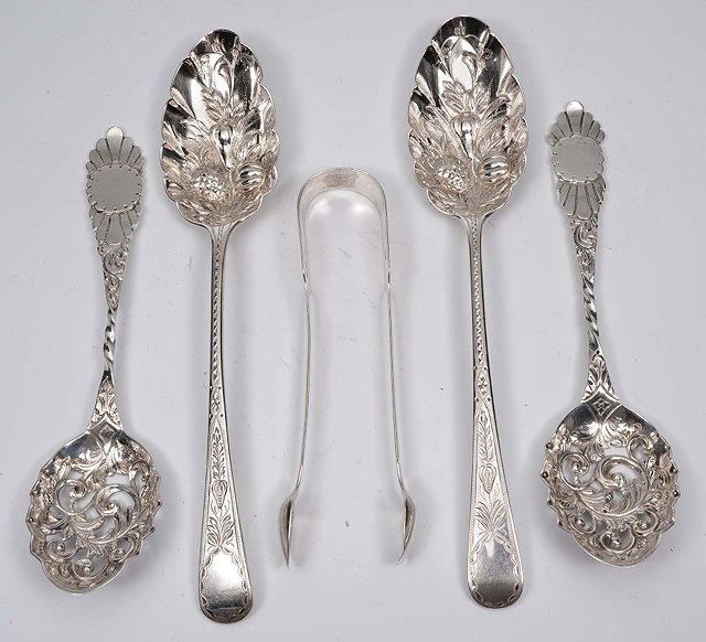 Appraisal: A pair of Georgian silver berry spoonswith embossed and chased