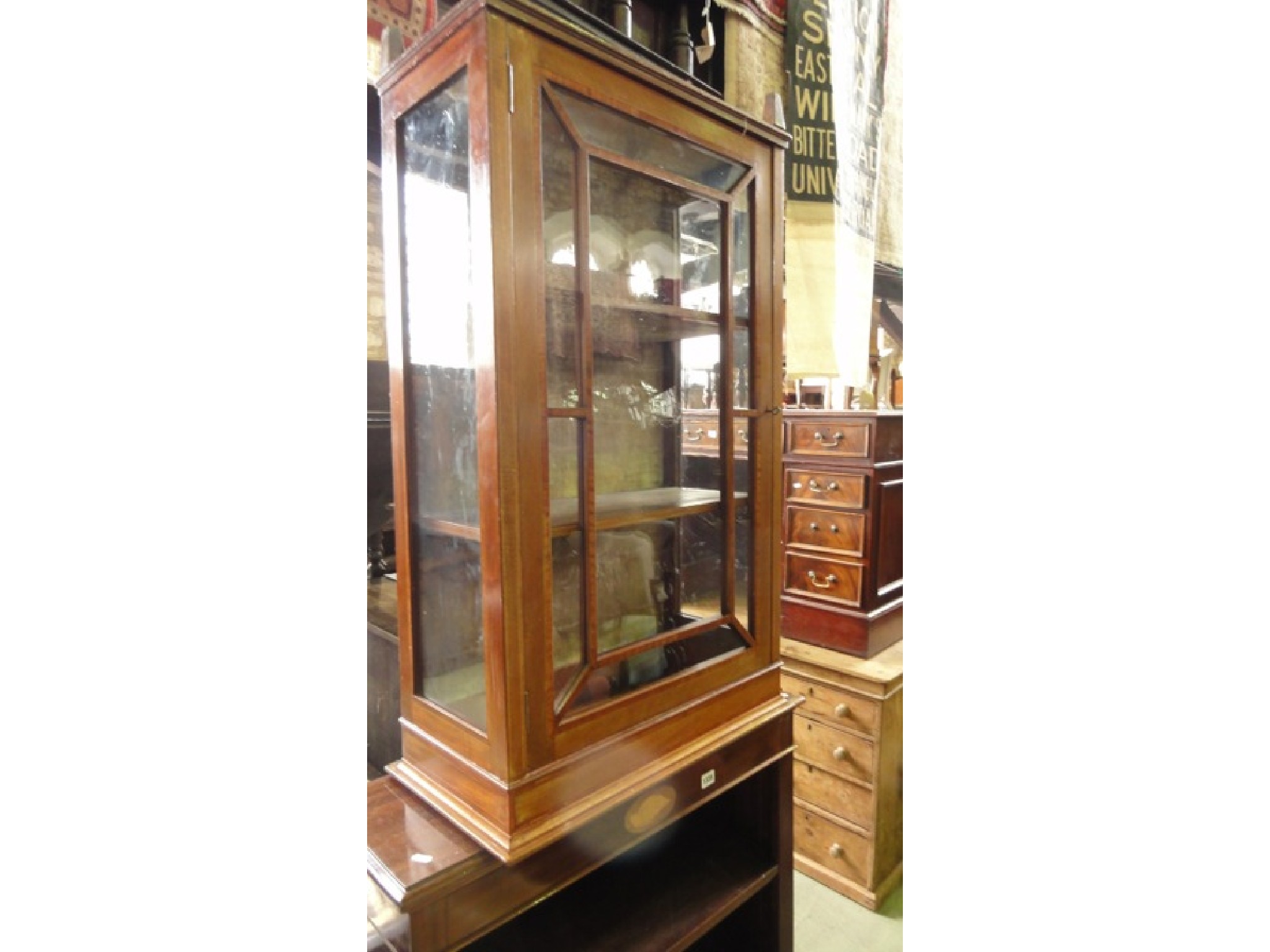 Appraisal: A small inlaid Edwardian mahogany freestanding display cabinet enclosed by