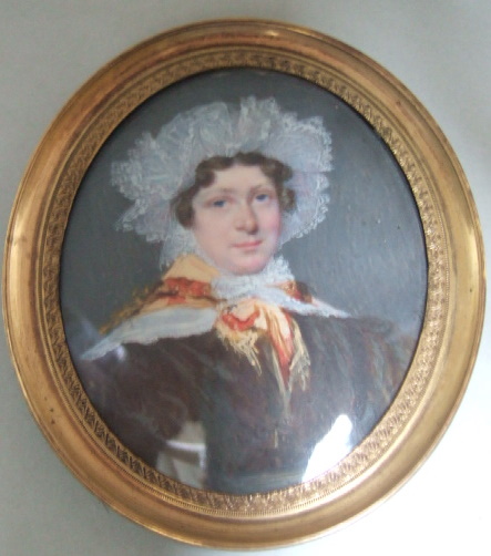 Appraisal: An oval portrait miniature of a lady wearing a white