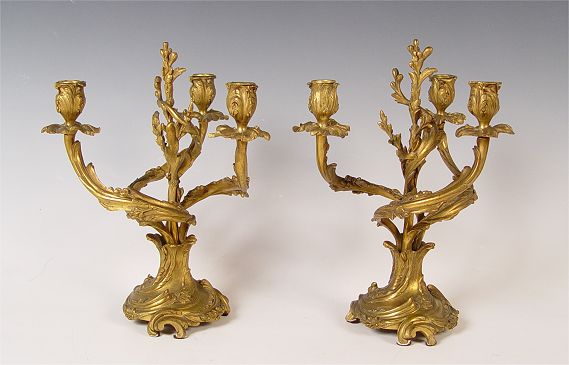 Appraisal: PAIR ROCOCO GILT BRONZE CANDELABRA Three light swirl arm candelabra