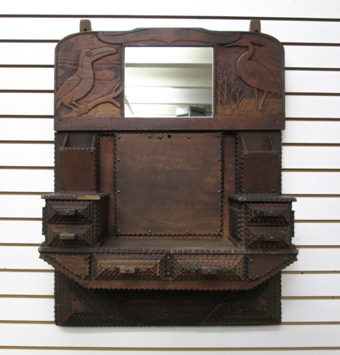 Appraisal: AN AMERICAN TRAMP ART CARVED WALL MIRROR with detailed animal