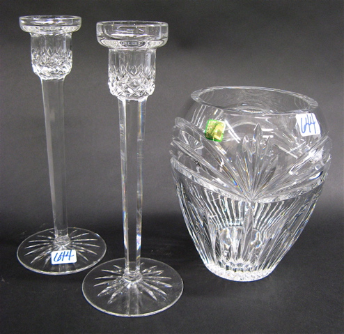 Appraisal: WATERFORD CUT CRYSTAL CANDLESTICKS VASE pieces the tall clear candlesticks