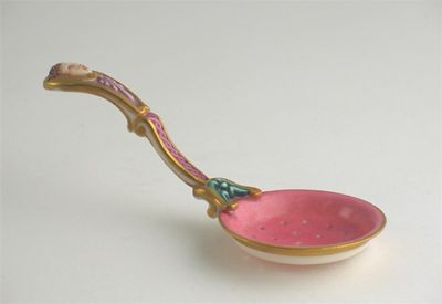 Appraisal: A sifter spoon the handle moulded with a face unmarked