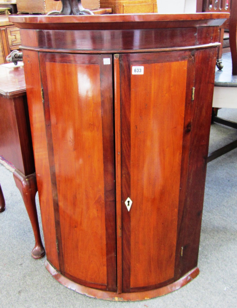 Appraisal: An th century mahogany hanging bowfront corner cupboard cm wide