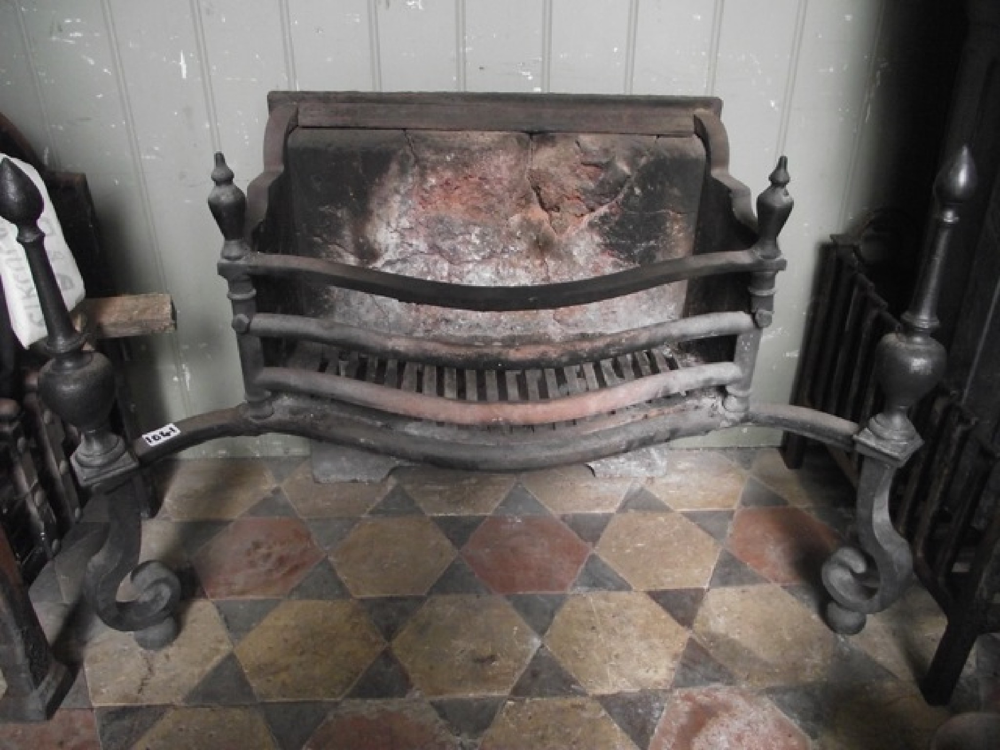 Appraisal: A th century cast iron fire basket with serpentine front