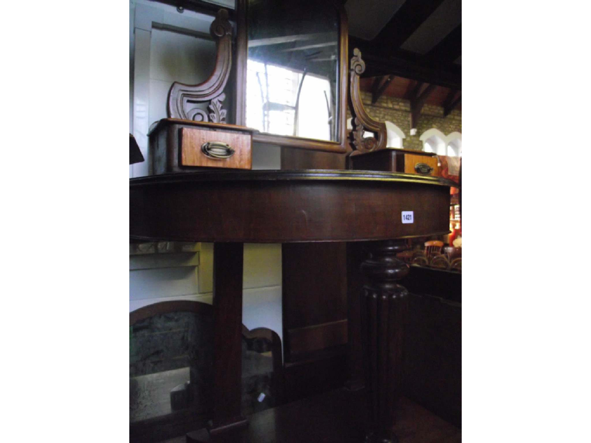 Appraisal: A Victorian mahogany demi-lune dressing table with raised back on