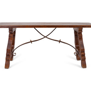 Appraisal: A Spanish Colonial Style Trestle Table With Wrought Iron Stretcher