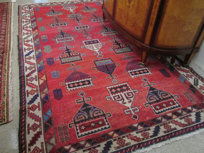 Appraisal: PERSIAN SHIRVAN CARPET Caucasian Kazak influence featuring a red field