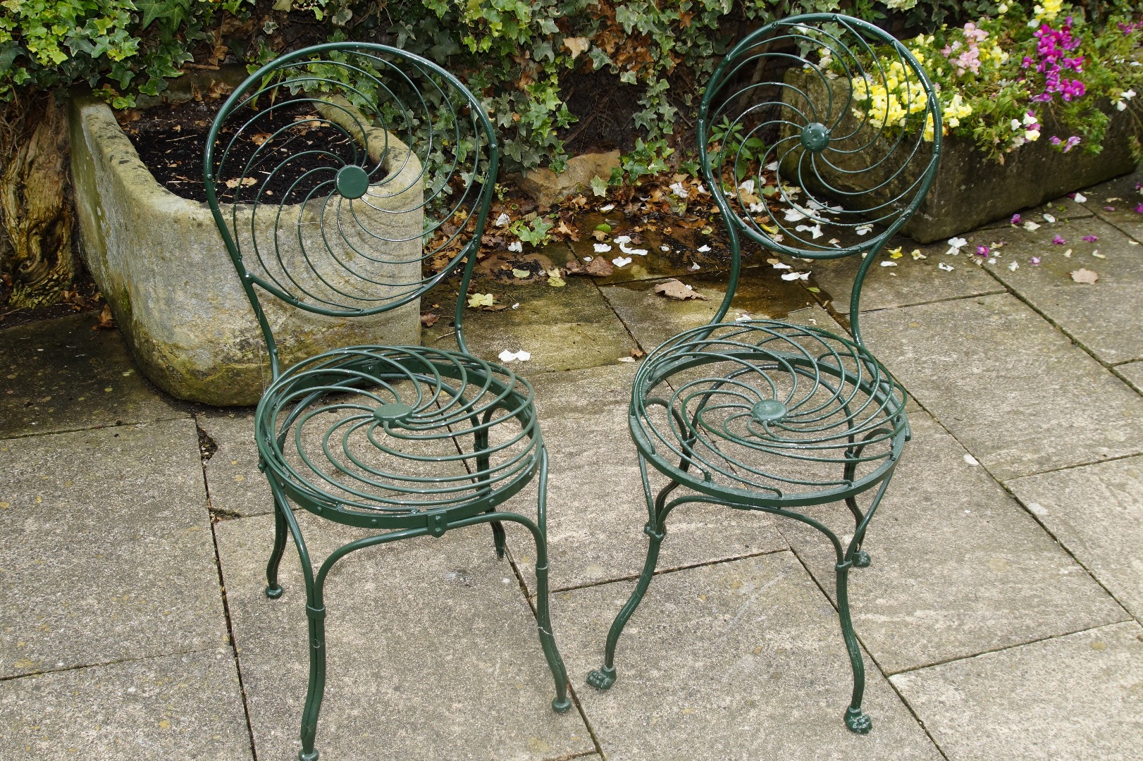 Appraisal: Four wrought iron and wirework garden chairs including armchair