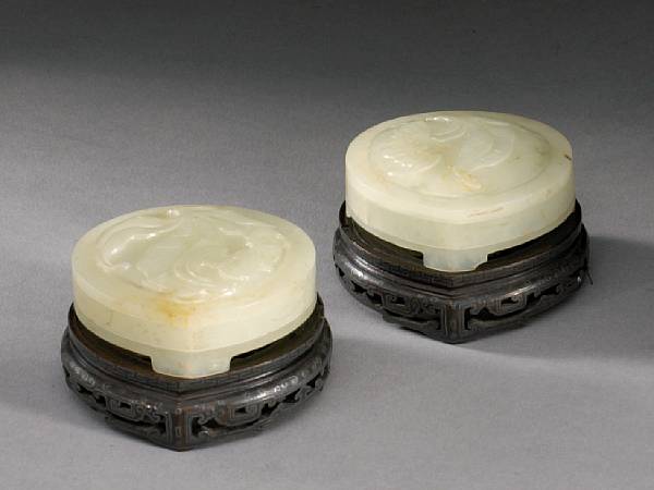 Appraisal: A pair of white jade two-sectioned covered boxes Each designed