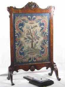 Appraisal: A walnut veneered tapestry fire screen in the George II