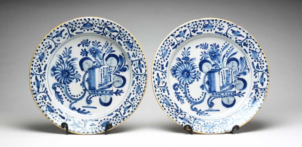 Appraisal: PAIR OF DELFT CHARGERS Eighteen century Stylized blue and white