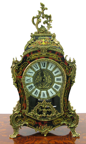 Appraisal: A FRENCH BOULE STYLE MANTEL SHELF CLOCK The gilt metal