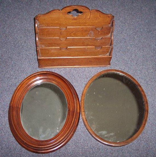 Appraisal: Two oval mirrors and a stationery rack