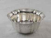 Appraisal: A silver fluted and chased sugar bowl Sheffield approx weight