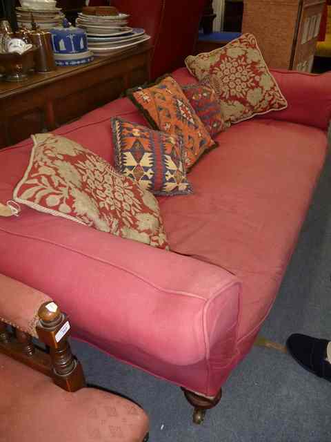 Appraisal: A VICTORIAN CHESTERFIELD SETTEE with rolled back and turned legs