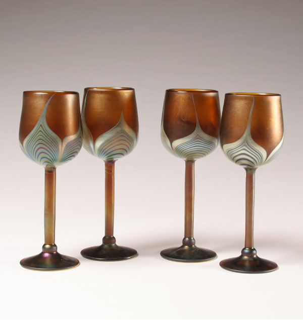 Appraisal: Four Correia amber art glass goblets iridescent pulled feather design