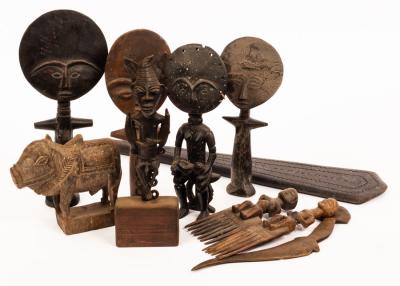 Appraisal: A quantity of tribal carvings to include a paddle figures