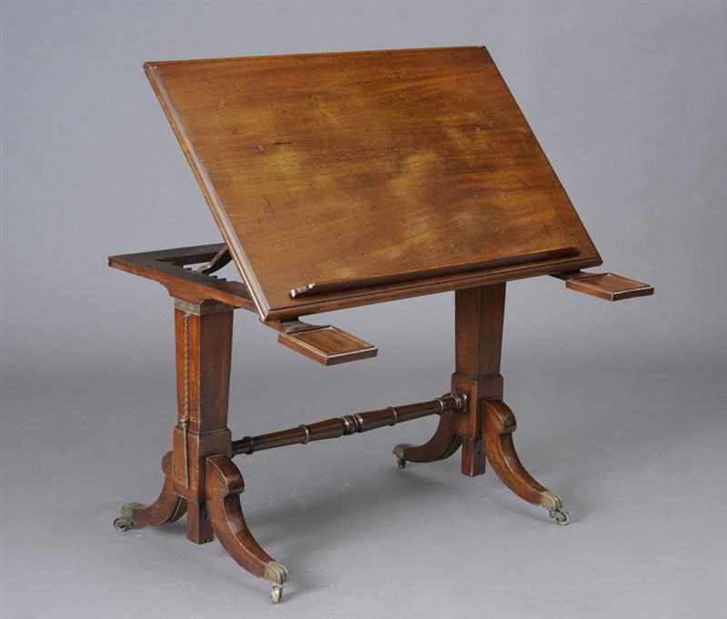 Appraisal: REGENCY BRASS-MOUNTED MAHOGANY DRAFTING TABLE The hinged adjustable top with