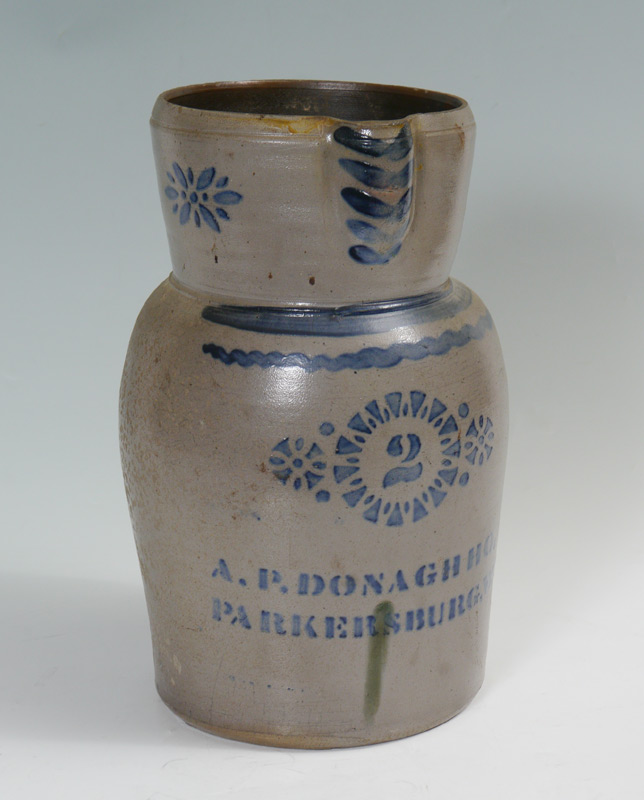 Appraisal: A P DONAGHHO GALLON BLUE DECORATED STONEWARE PITCHER Stencil rosettes