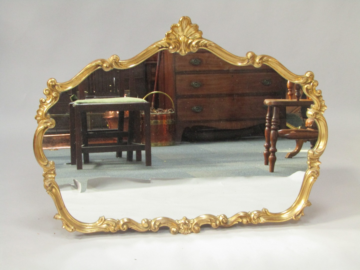 Appraisal: A Rococo style gilt plaster wall mirror with shell and