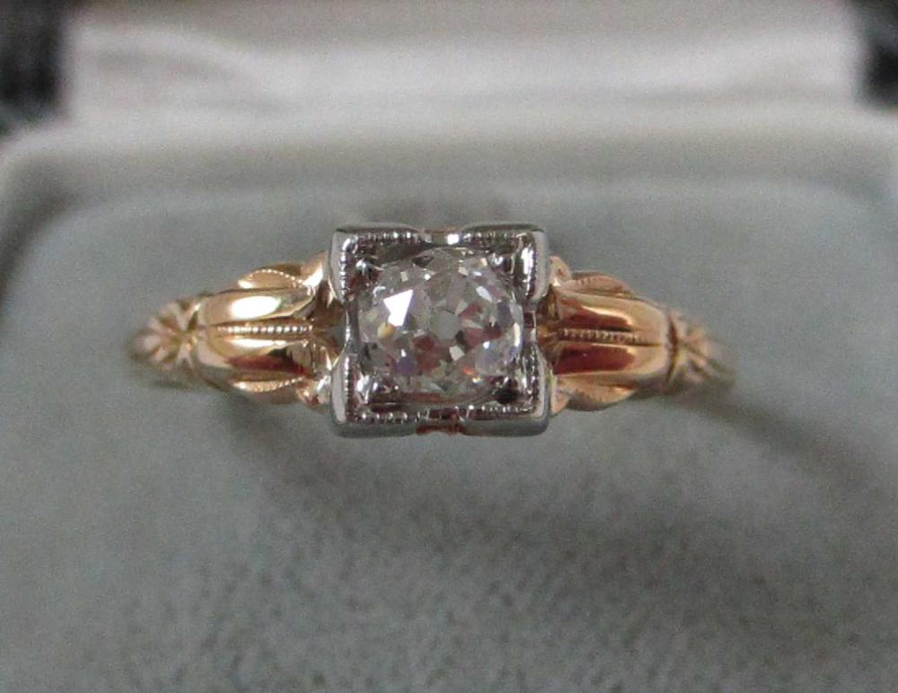 Appraisal: VINTAGE DIAMOND FOURTEEN EIGHTEEN KARAT GOLD SOLITAIRE RING set with