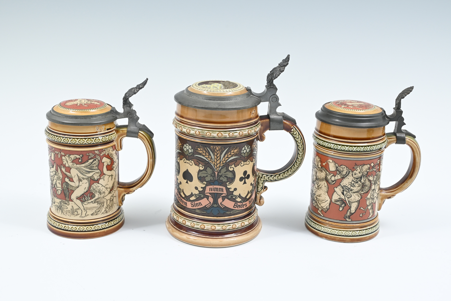 Appraisal: PC METTLACH BEER STEINS Comprising - Mettlach L Bacchus and