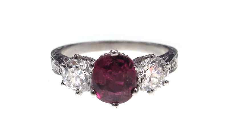 Appraisal: PLATINUM RUBY AND DIAMOND RING Platinum ring centering a one