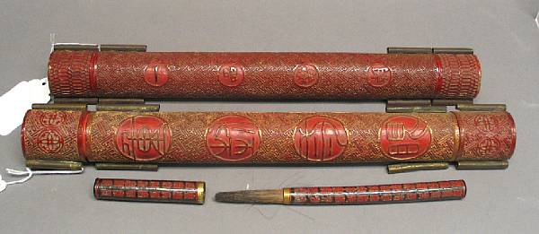 Appraisal: Two red lacquer peacock feather cases Each cylindrical case with