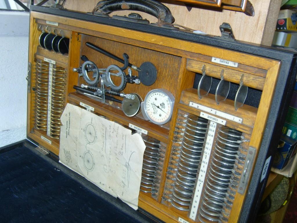 Appraisal: An early th century opticians case containing lenses gauges accessories