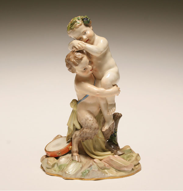 Appraisal: Meissen th century porcelain figural group of a child satyr