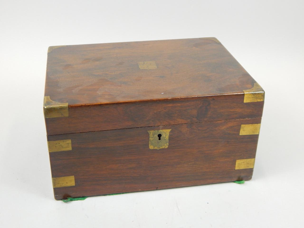 Appraisal: A Victorian walnut writing box with brass mounts and cartouche