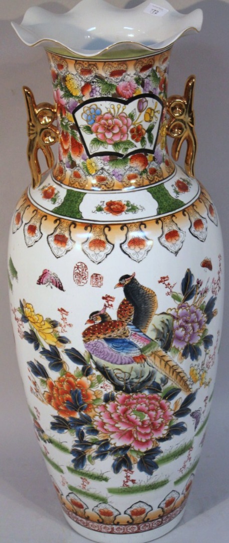 Appraisal: A thC Chinese pottery freestanding vase with a flared rim