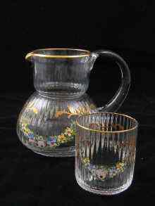 Appraisal: A Christian Dior ribbed glass bedside jug and beaker each