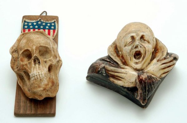 Appraisal: Two plaster wall match safes One of fully articulated skull