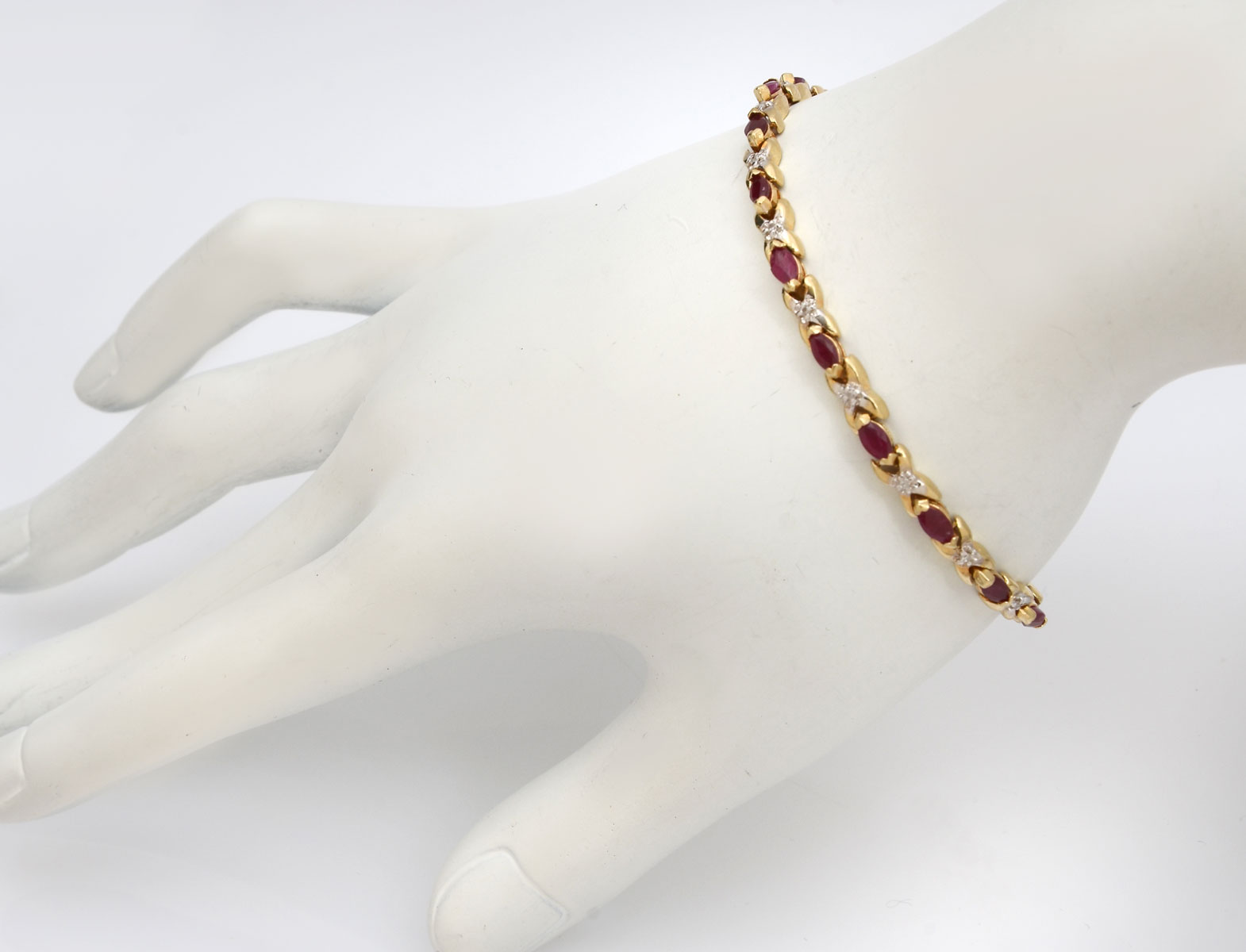 Appraisal: K RUBY DIAMOND BRACELET K yellow gold bracelet contains marquise