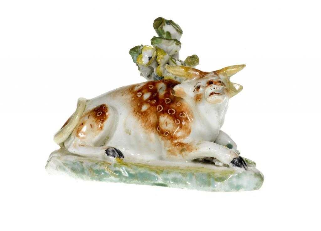 Appraisal: A DERBY MODEL OF A RECUMBENT BULL enamelled with red-brown