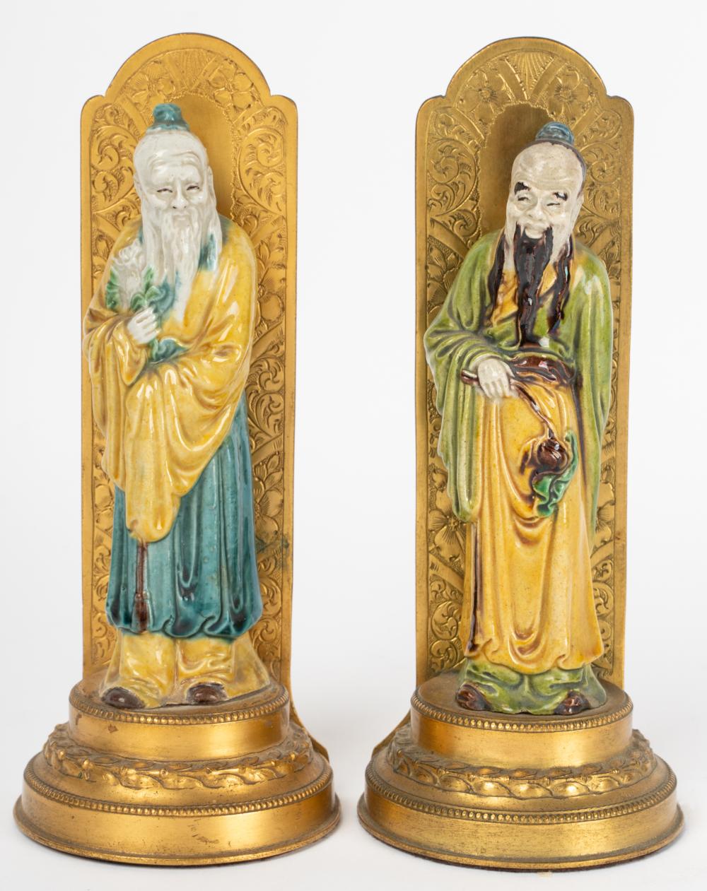 Appraisal: PAIR OF CHINESE PORCELAIN FIGURESmounted as bookends on gilt metal